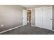 This bedroom has neutral walls, and a closet with sliding doors for plenty of storage space at 1484 Nemrick Pl, Castle Rock, CO 80109