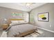 Comfortable bedroom featuring vaulted ceiling, natural light, and neutral colors at 1484 Nemrick Pl, Castle Rock, CO 80109