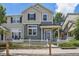 Charming two-story home with a well-maintained lawn and a white picket fence at 1484 Nemrick Pl, Castle Rock, CO 80109