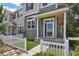Inviting front porch with white columns and a walkway leading to the front door at 1484 Nemrick Pl, Castle Rock, CO 80109
