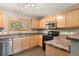 Functional kitchen with stainless steel appliances and bright, natural light at 1484 Nemrick Pl, Castle Rock, CO 80109