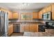 Well-equipped kitchen with stainless steel appliances and ample countertop space at 1484 Nemrick Pl, Castle Rock, CO 80109