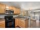 Modern kitchen with stainless steel appliances and views of the open floor plan at 1484 Nemrick Pl, Castle Rock, CO 80109