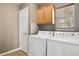 Convenient laundry room with a full-size washer and dryer at 1484 Nemrick Pl, Castle Rock, CO 80109