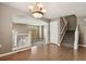 Open-concept living area with hardwood flooring, staircase, and natural light at 1484 Nemrick Pl, Castle Rock, CO 80109