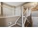 Elegant staircase with white railings and carpeted steps leading to the upper level at 1484 Nemrick Pl, Castle Rock, CO 80109