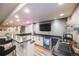 Finished basement bar with modern finishes, granite counters, mini fridge, and a sink at 11303 Tango Ln, Parker, CO 80134