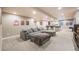 Large basement rec room, featuring a sprawling sectional and entertaining area at 11303 Tango Ln, Parker, CO 80134