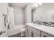 Bathroom featuring shower over tub, modern vanity, and attractive accent tile at 11303 Tango Ln, Parker, CO 80134