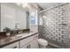 Modern bathroom features a glass shower with subway tile, and a sink with black hardware at 11303 Tango Ln, Parker, CO 80134