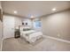 Cozy bedroom with neutral carpet, white trim, and large window for natural light at 11303 Tango Ln, Parker, CO 80134