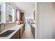 Modern kitchen features gray cabinets, a white countertop, and stainless steel appliances at 11303 Tango Ln, Parker, CO 80134