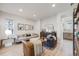 Bright living room with wood-style flooring, contemporary furnishings, and abundant natural light at 11303 Tango Ln, Parker, CO 80134