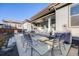 Outdoor patio with seating, grill, umbrella and ceiling fan at 11303 Tango Ln, Parker, CO 80134