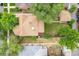 Aerial view of a home with a well-manicured backyard, surrounded by lush greenery and mature trees at 1457 S Franklin St, Denver, CO 80210
