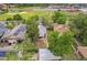 Overhead view of home nestled among mature trees, conveniently located near recreational amenities and community resources at 1457 S Franklin St, Denver, CO 80210