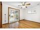 Bedroom featuring hardwood floors, ceiling fan, and sliding glass door at 1457 S Franklin St, Denver, CO 80210
