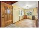 Welcoming entryway with hardwood floors, complemented by natural light from nearby windows at 1457 S Franklin St, Denver, CO 80210