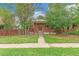 Charming brick home with a cozy front porch and a well-maintained lawn, creating a welcoming curb appeal at 1457 S Franklin St, Denver, CO 80210