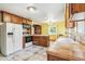 Spacious kitchen with tile flooring, a large island, and cabinetry at 1457 S Franklin St, Denver, CO 80210