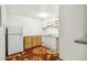 Basement kitchenette features a refrigerator, cabinets and a sink at 1457 S Franklin St, Denver, CO 80210