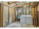 Unfinished laundry area featuring a utility sink, and washer and dryer at 1457 S Franklin St, Denver, CO 80210