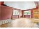 Spacious living room with hardwood floors and large windows, providing ample natural light at 1457 S Franklin St, Denver, CO 80210