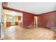 Open living area with hardwood floors, seamlessly connecting to the entryway and kitchen at 1457 S Franklin St, Denver, CO 80210