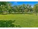 Expansive green park with picnic tables, perfect for outdoor gatherings, relaxation, and enjoying the surrounding nature at 1457 S Franklin St, Denver, CO 80210