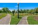 A serene park landscape featuring winding paths, vibrant flowers, and lush greenery, perfect for peaceful strolls at 1457 S Franklin St, Denver, CO 80210