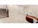 Spacious finished basement with carpet flooring, ideal for a playroom or recreational area at 7602 S Yakima Ct, Aurora, CO 80016