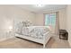 Comfortable bedroom with neutral tones, white furniture, and a window letting in natural light at 7602 S Yakima Ct, Aurora, CO 80016
