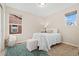 Cozy bedroom with natural light from two windows and a stylish blue patterned rug at 7602 S Yakima Ct, Aurora, CO 80016