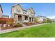 Charming two-story home with stone accents, manicured lawn, and inviting curb appeal at 7602 S Yakima Ct, Aurora, CO 80016