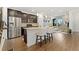 Well-equipped kitchen with stainless steel appliances and open view to the living room at 7602 S Yakima Ct, Aurora, CO 80016