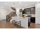 Stylish kitchen island with breakfast bar, stainless steel appliances, and ample cabinet space at 7602 S Yakima Ct, Aurora, CO 80016