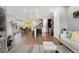 Bright and airy living space with open layout connecting kitchen, dining, and living areas at 7602 S Yakima Ct, Aurora, CO 80016