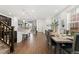 Open concept living space with dining area and kitchen island seating at 7602 S Yakima Ct, Aurora, CO 80016