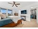 Inviting main bedroom with a large window, ceiling fan, and en-suite closet at 7602 S Yakima Ct, Aurora, CO 80016