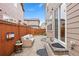 Cozy patio area with outdoor seating and a fenced yard, perfect for relaxation and entertainment at 7602 S Yakima Ct, Aurora, CO 80016