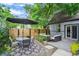 Outdoor patio with dining area, comfortable seating, and a modern fence for privacy at 4570 Irving St, Denver, CO 80211