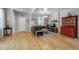 Spacious living room with hardwood floors, gray sectional, and decorative shelving for a cozy atmosphere at 4570 Irving St, Denver, CO 80211