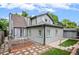 View of the backyard featuring raised garden beds, hardscaped patio and gray exterior at 4570 Irving St, Denver, CO 80211
