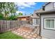 Backyard view featuring garden beds, greenery, and a partial view of the home's exterior at 4570 Irving St, Denver, CO 80211