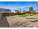 Wide shot of backyard with fence and rock landscaping at 19721 E Vassar Ave, Aurora, CO 80013
