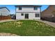 Backyard with small lawn and a gravel area at 19721 E Vassar Ave, Aurora, CO 80013