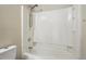 Close-up of a bathtub with a shower panel, including the faucet handles and shower head fixture at 19721 E Vassar Ave, Aurora, CO 80013
