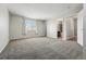 Inviting main bedroom featuring neutral tones, carpet, and ample natural light at 19721 E Vassar Ave, Aurora, CO 80013