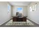 Dedicated home office space featuring a modern desk, neutral walls, and a comfortable work environment at 19721 E Vassar Ave, Aurora, CO 80013
