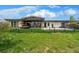 Expansive backyard features a patio with outdoor seating, perfect for relaxation and entertaining at 6 Wilder Ln, Littleton, CO 80123